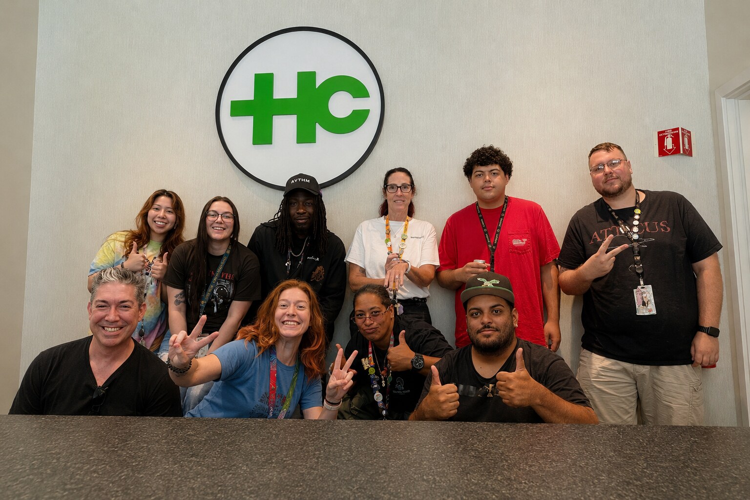 Health Circle team members gathered together beneath the company logo
