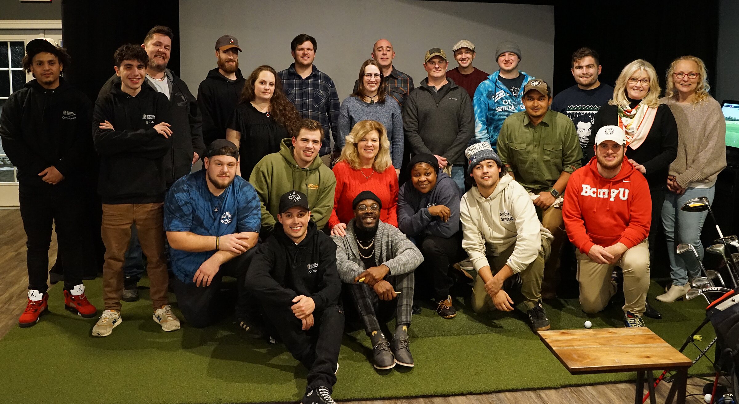 Nimbus Cannabis Co team members posing together at their Hudson workplace
