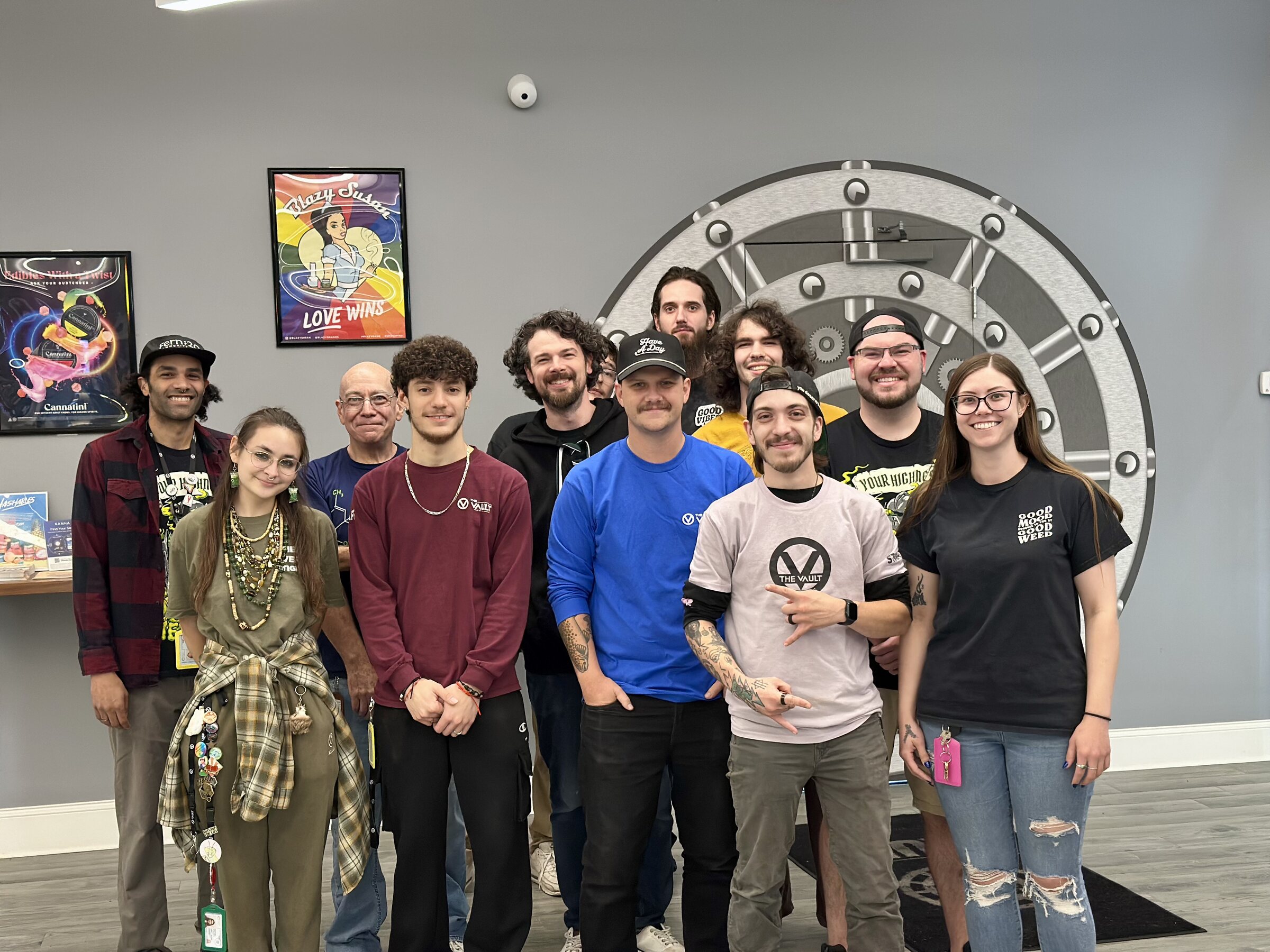 The Vault team members gathered inside the Webster retail storefront